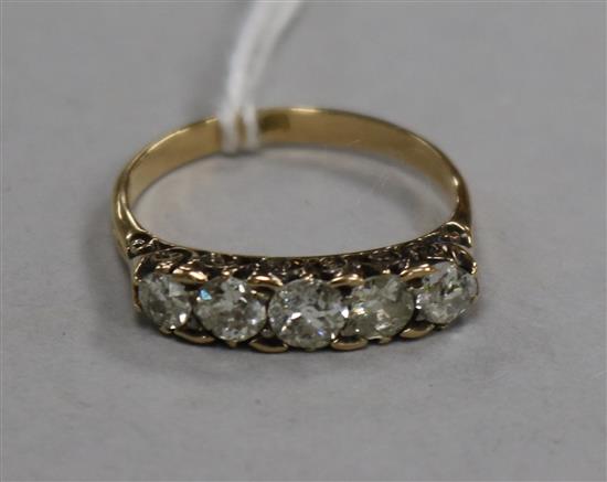 An 18ct gold and five stone diamond ring, size O.